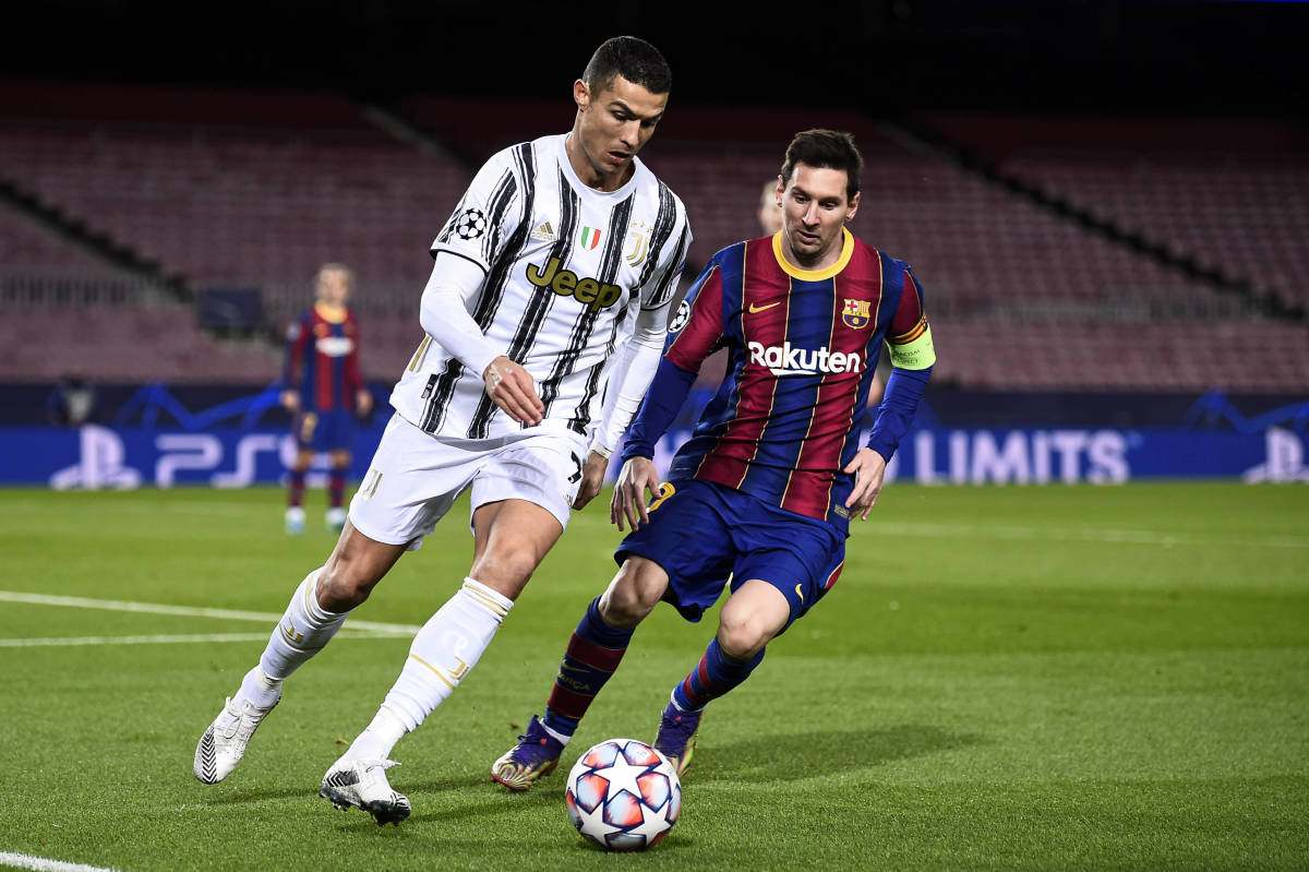 Cristiano Ronaldo (left) and Lionel Messi pictured in action during a UEFA Champions League game between Barcelona and Juventus in December 2020